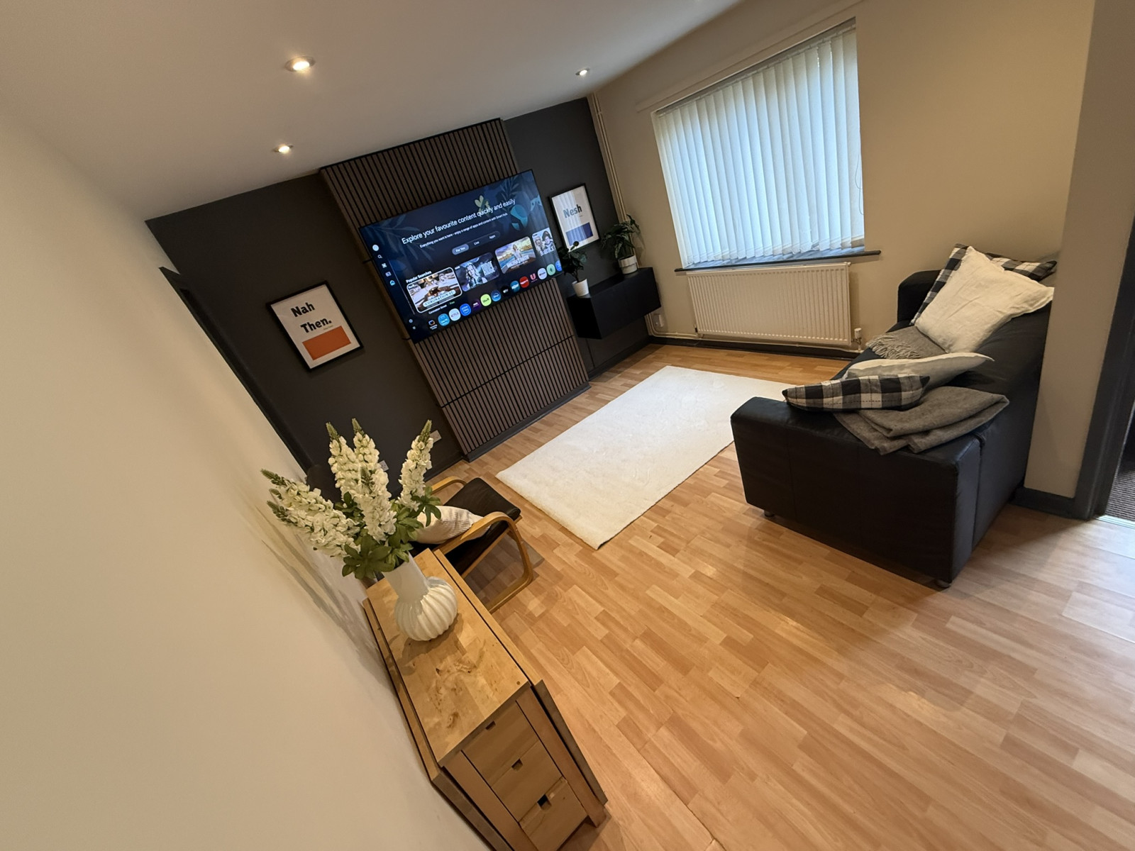 Lounge with media wall at 24 Broom Walk